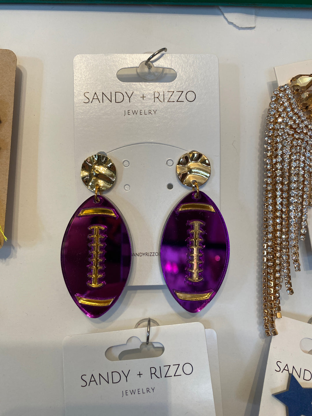 Purple mirrored football earring